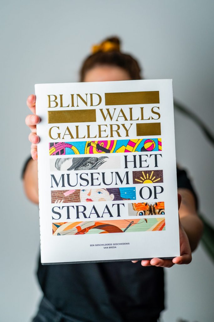 2020 blind walls gallery the museum on the street anniversary book in hands 2