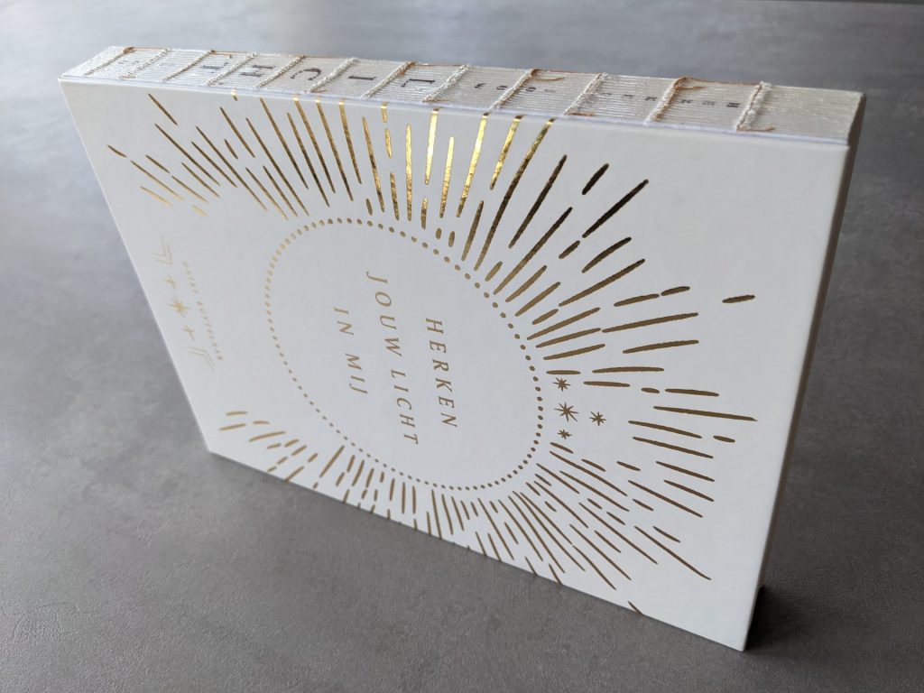 Recognise your light in me binding and gold foil on front cover visible